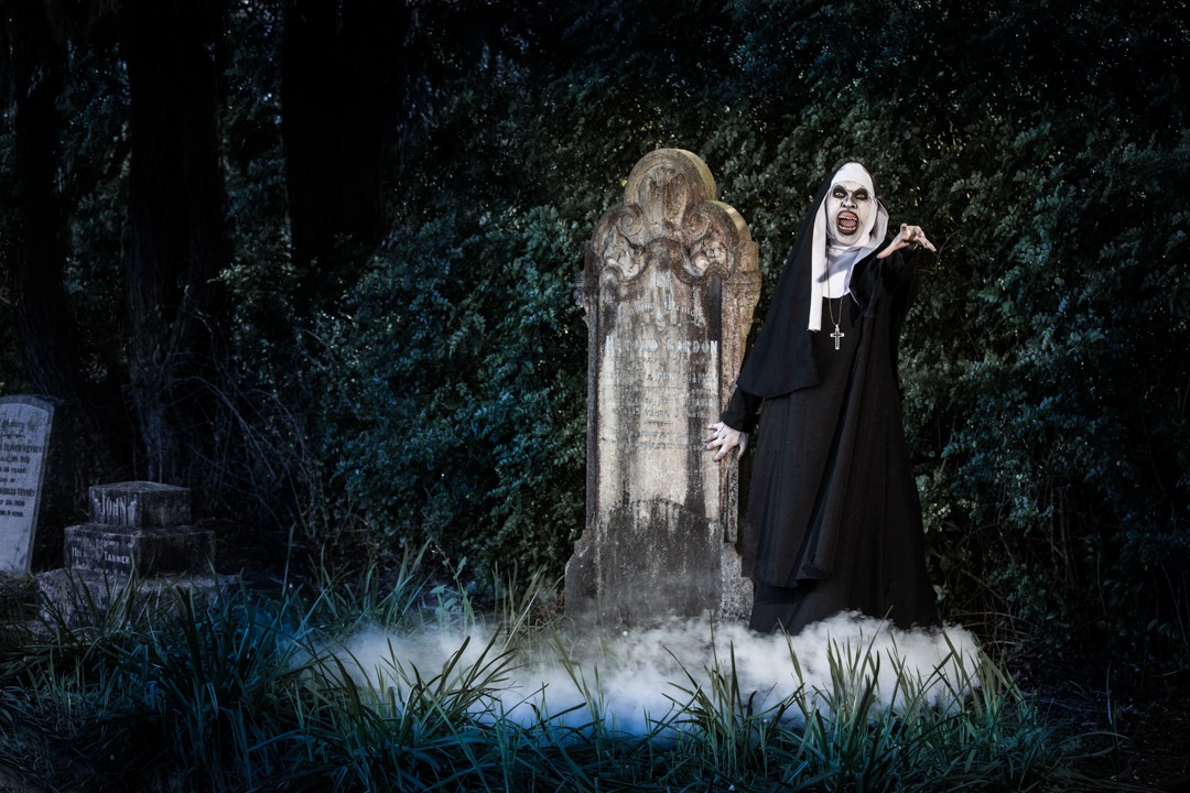 the evil nun in a misty graveyard